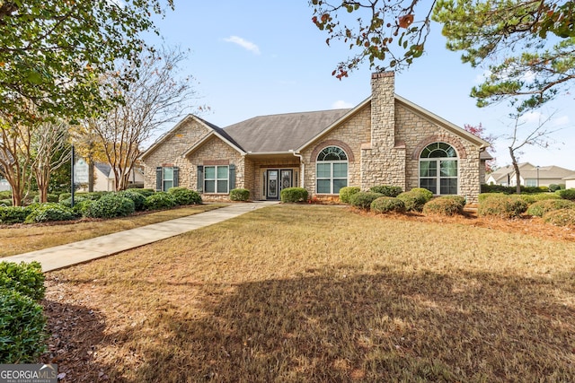 ranch-style house with a front yard