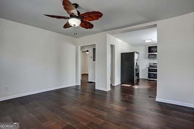 empty room featuring ceiling fan and dark hardwood / wood-style flooring