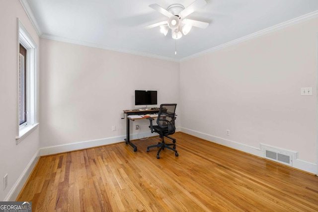 office with light hardwood / wood-style flooring, ceiling fan, and crown molding