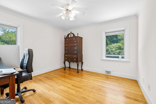 office area featuring light hardwood / wood-style floors, crown molding, ceiling fan, and a healthy amount of sunlight