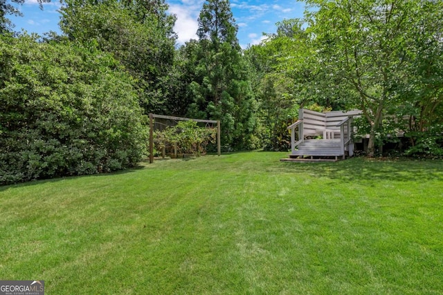 view of yard featuring a wooden deck