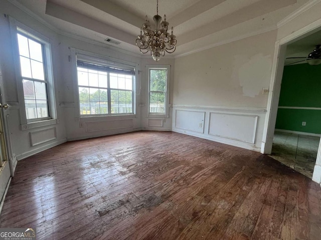 unfurnished dining area featuring hardwood / wood-style floors, ceiling fan with notable chandelier, and ornamental molding