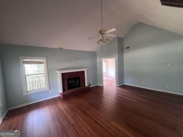 unfurnished living room featuring dark hardwood / wood-style floors, ceiling fan, a fireplace, and high vaulted ceiling