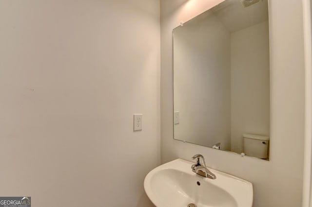 bathroom with toilet and sink