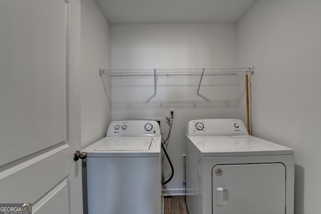 washroom featuring washer and dryer and hardwood / wood-style flooring