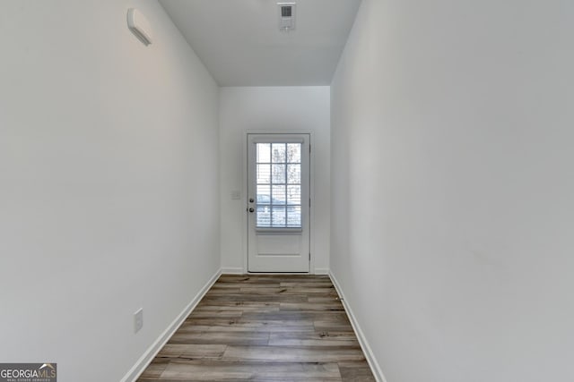 doorway with light wood-type flooring