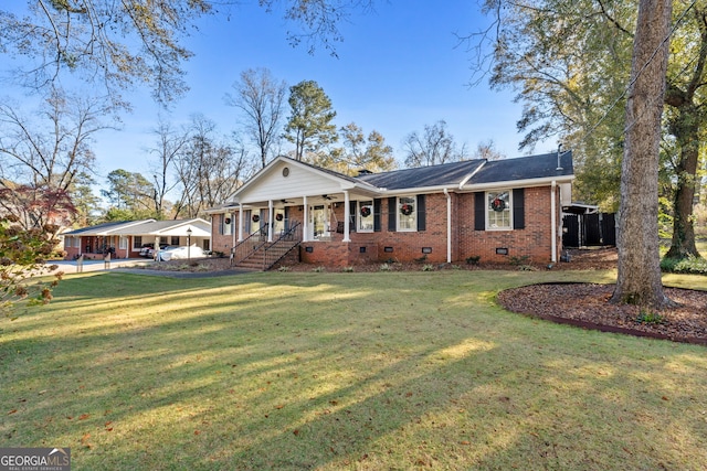 single story home featuring covered porch and a front yard