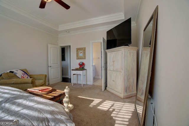 living room featuring a raised ceiling, ceiling fan, light colored carpet, and crown molding