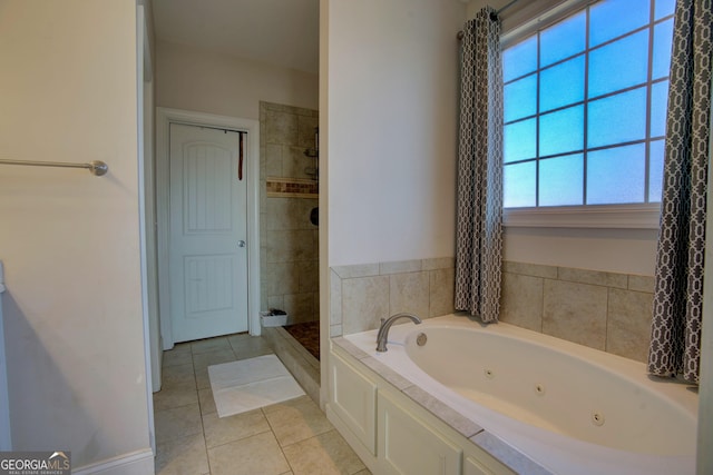 bathroom featuring tile patterned floors, separate shower and tub, and a wealth of natural light