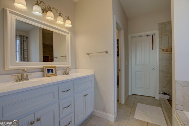 bathroom with tile patterned flooring and vanity