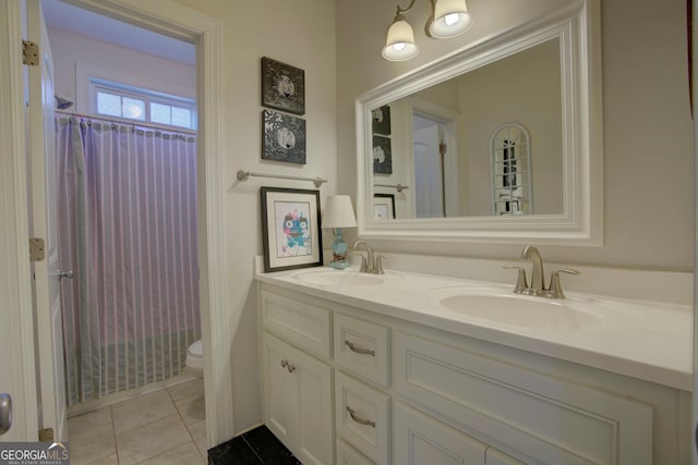 full bathroom featuring toilet, shower / tub combo, vanity, and tile patterned floors