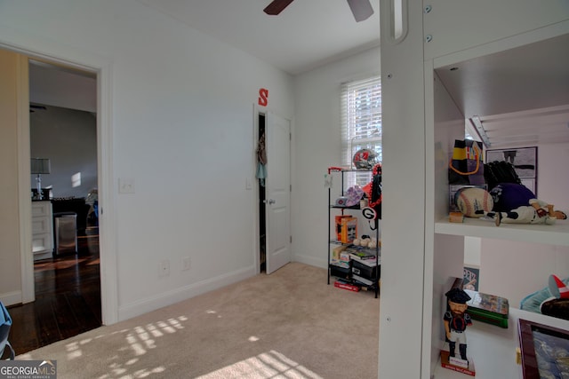 bedroom featuring ceiling fan and light colored carpet