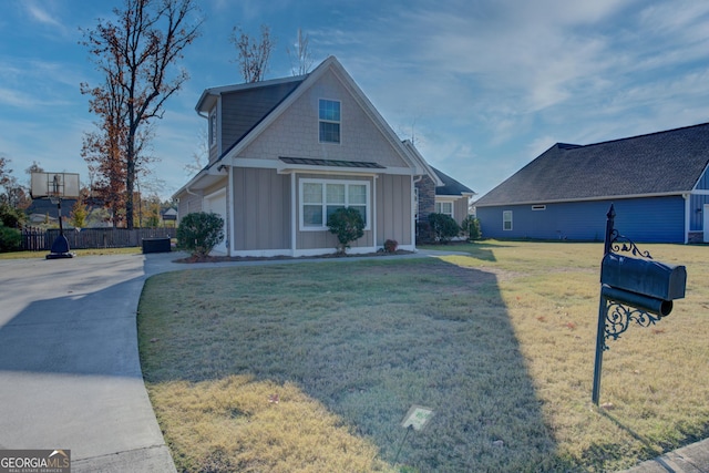 view of front facade with a garage and a front lawn