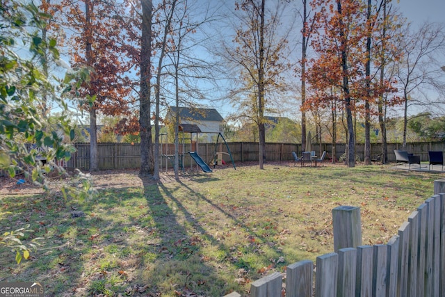 view of yard with a playground