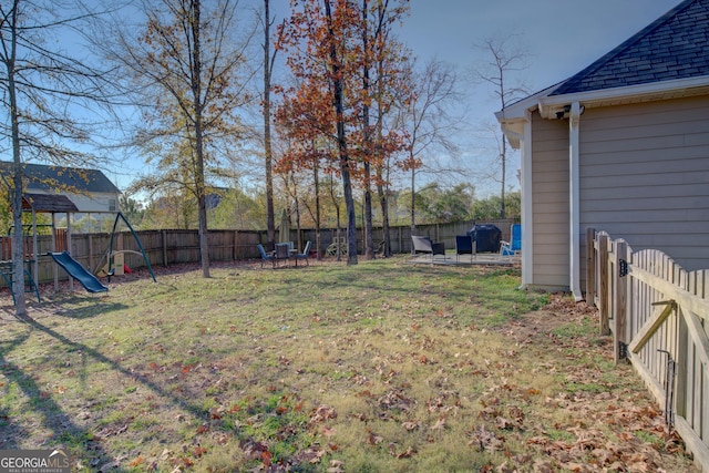 view of yard with a playground