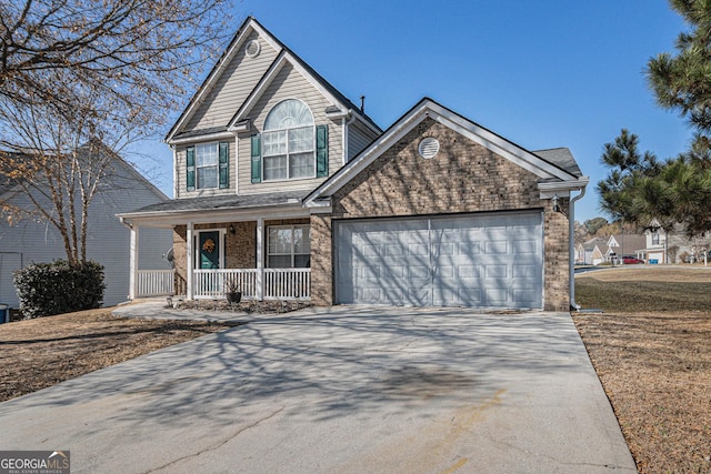 view of front property with a porch and a garage