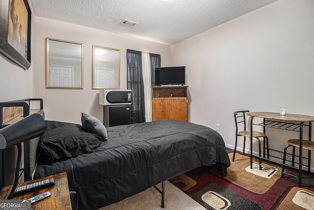 bedroom with a textured ceiling