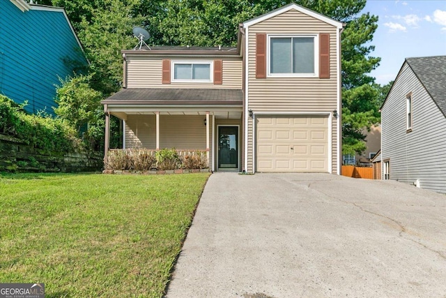 traditional home featuring a garage, a front yard, and covered porch