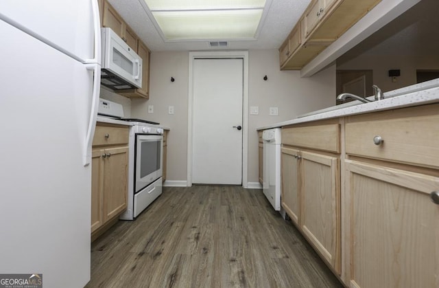 kitchen featuring light brown cabinets, white appliances, and hardwood / wood-style flooring