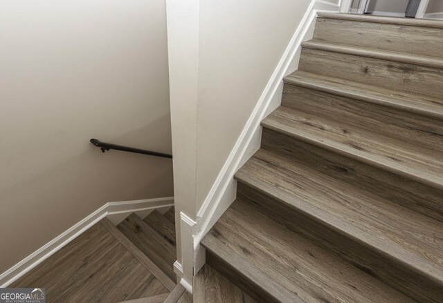 stairs with wood-type flooring