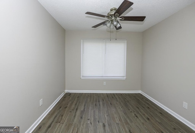 unfurnished room featuring dark hardwood / wood-style floors, ceiling fan, and a textured ceiling