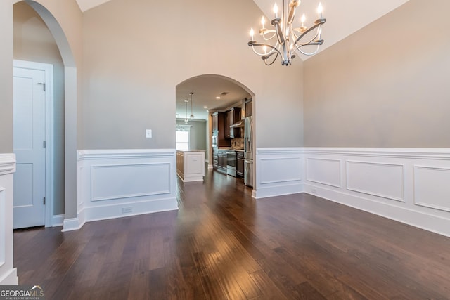 unfurnished dining area featuring dark wood-type flooring