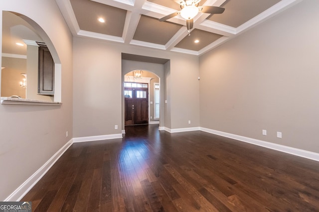 foyer entrance with beamed ceiling, crown molding, coffered ceiling, and dark hardwood / wood-style flooring