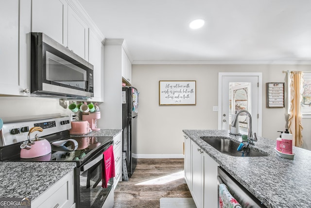 kitchen featuring white cabinetry, sink, appliances with stainless steel finishes, and dark wood-type flooring