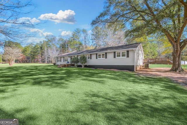 single story home featuring a front yard and central air condition unit