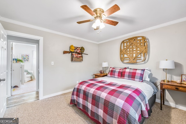 bedroom with ceiling fan and crown molding