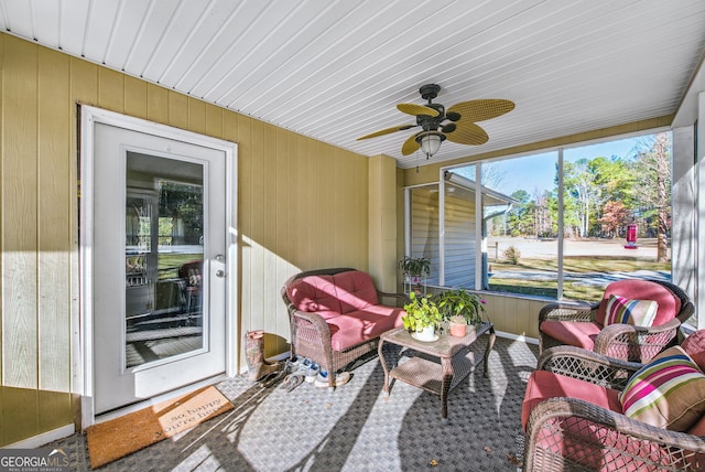 sunroom featuring ceiling fan