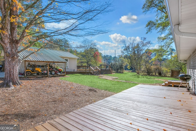 wooden deck with a lawn