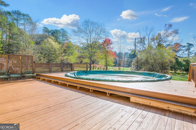 deck with a covered pool