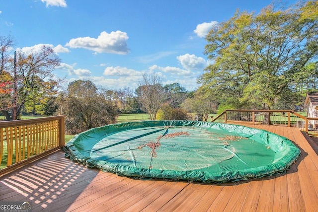 view of pool featuring a deck