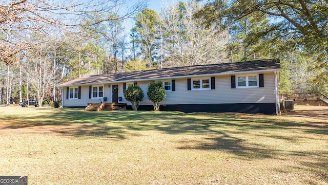 ranch-style home with a front lawn and cooling unit