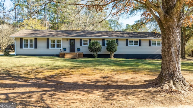 single story home with a front lawn