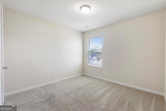 empty room featuring carpet flooring