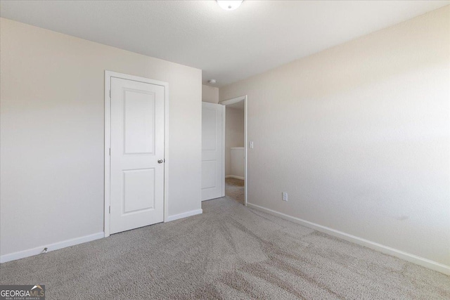 unfurnished bedroom with carpet flooring