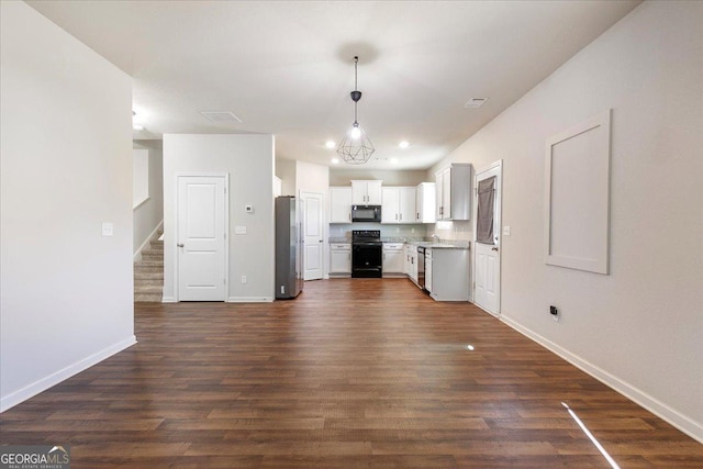 kitchen featuring pendant lighting, white cabinetry, dark wood-type flooring, and black appliances