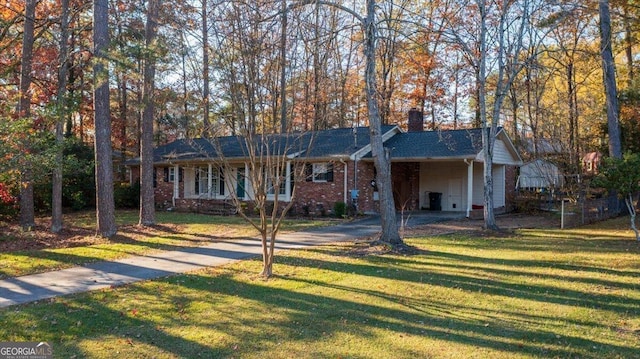 ranch-style home featuring a front yard and a carport