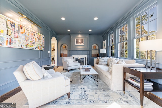 living room featuring hardwood / wood-style floors and ornamental molding