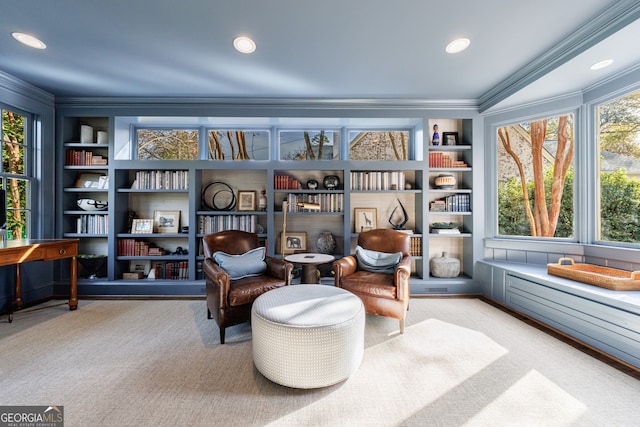 living area featuring light carpet, built in features, and ornamental molding