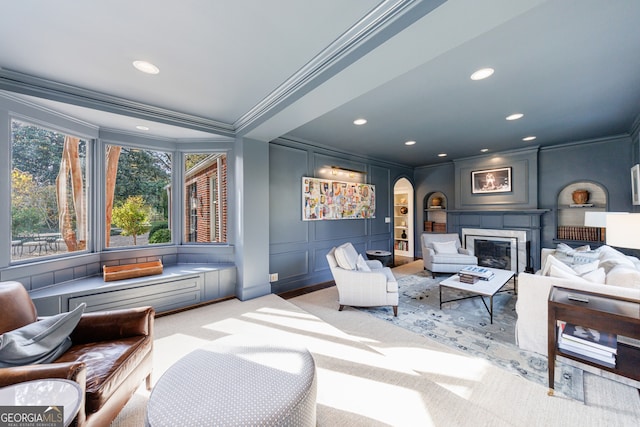 carpeted living room with crown molding