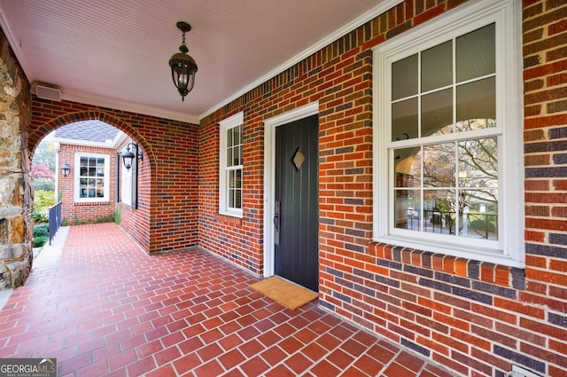 entrance to property featuring a porch