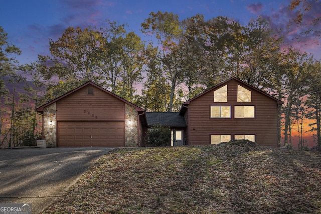 front facade with a garage