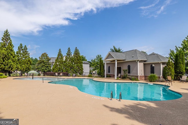 view of swimming pool featuring a patio area
