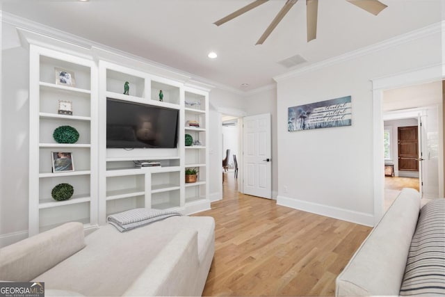 living room featuring ceiling fan, light hardwood / wood-style flooring, and ornamental molding