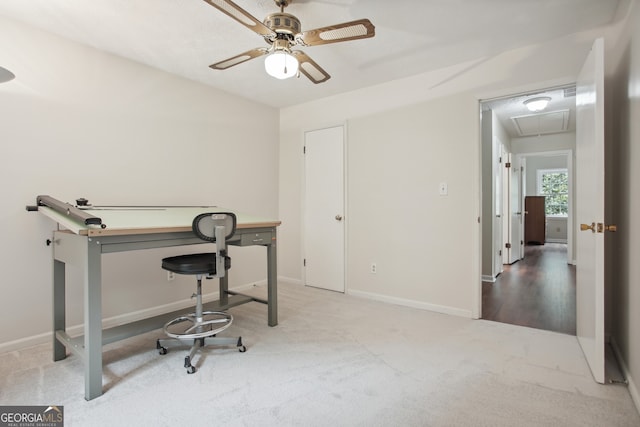 carpeted home office with ceiling fan