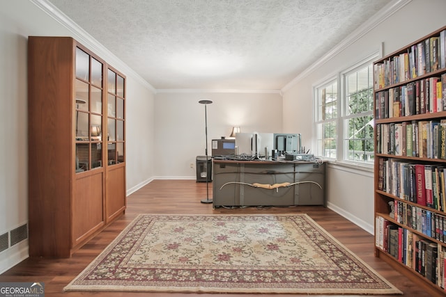 office area with wood-type flooring, a textured ceiling, and ornamental molding