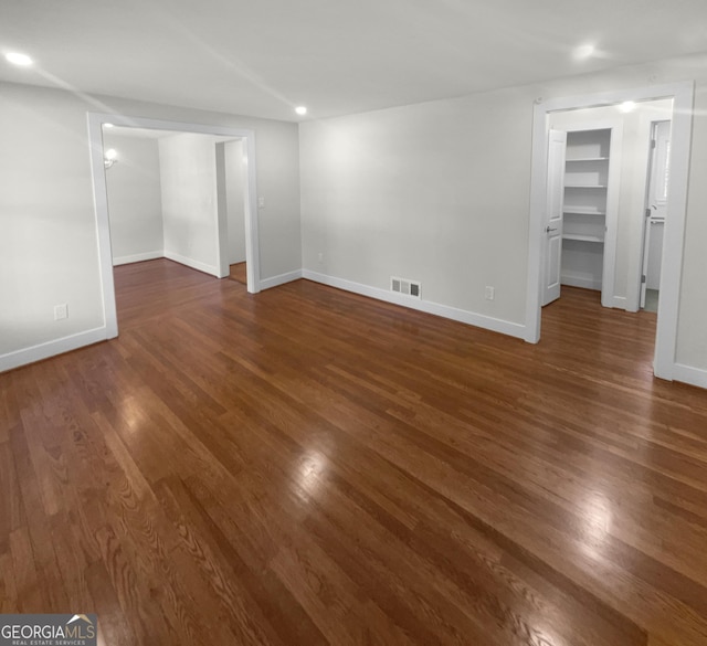 spare room with dark hardwood / wood-style floors